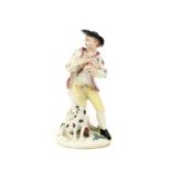 A Bow Porcelain Figure of a Shepherd, circa 1758, leaning against a tree trunk playing the bagpipes,