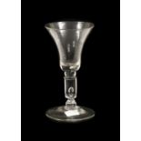 A Wine Glass, circa 1730, the bell-shaped bowl with air tear to solid base, on a balll knop and