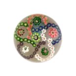 A Clichy Paperweight, circa 1850, the central canes within multi-coloured trefoil garlands7.5cm