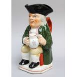 A 19th Century Pearlware Toby Jug, of Wood type, moulded with a mug of ale and clay pipe, painted in