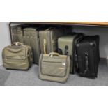 A Briggs & Riley Six Piece Luggage Set, in green fabric, Another Case in Black and A Green Travelpro