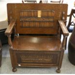 A Carved Oak Monks Bench, first half 20th century, on bun feet, 91cm by 48cm by 75cm