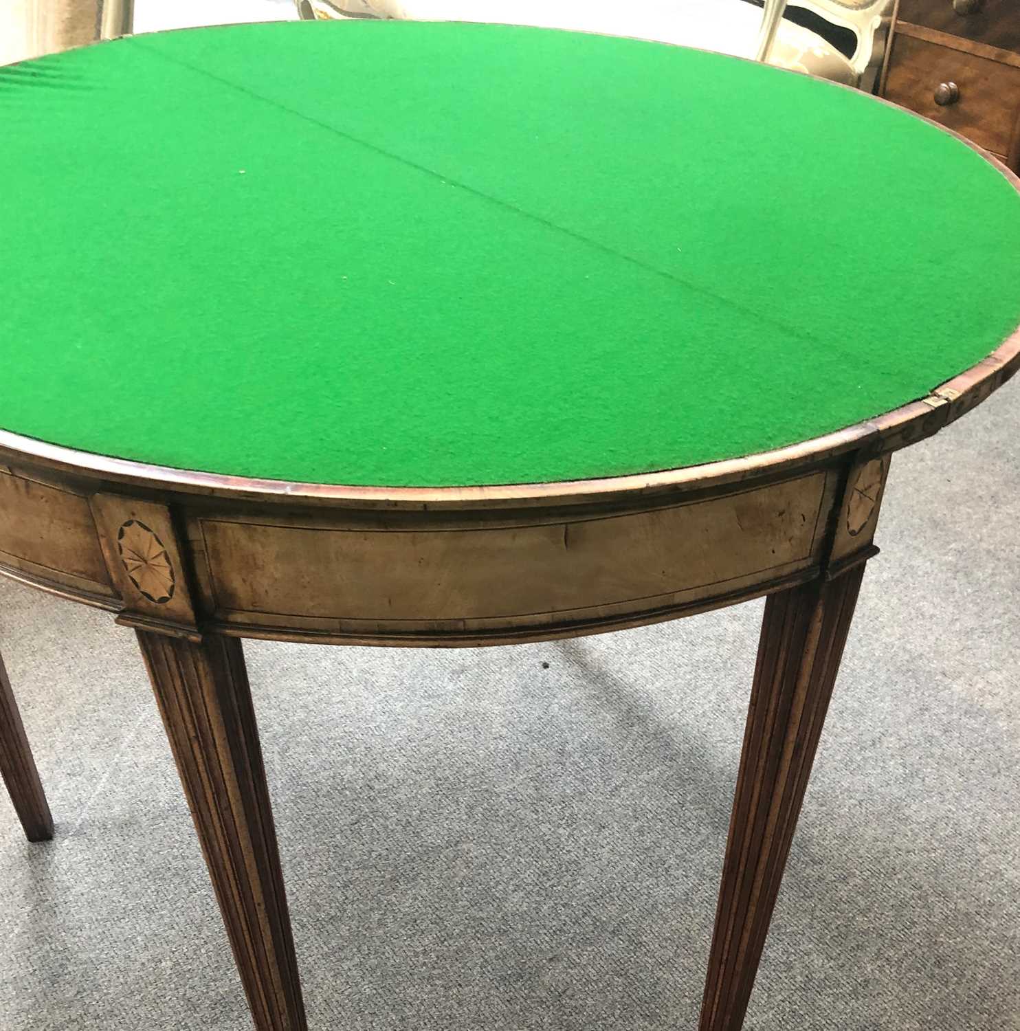 A George III Mahogany Demi Lune Fold Over Card Table, cross banded with fan paterer and on reeded - Image 8 of 9