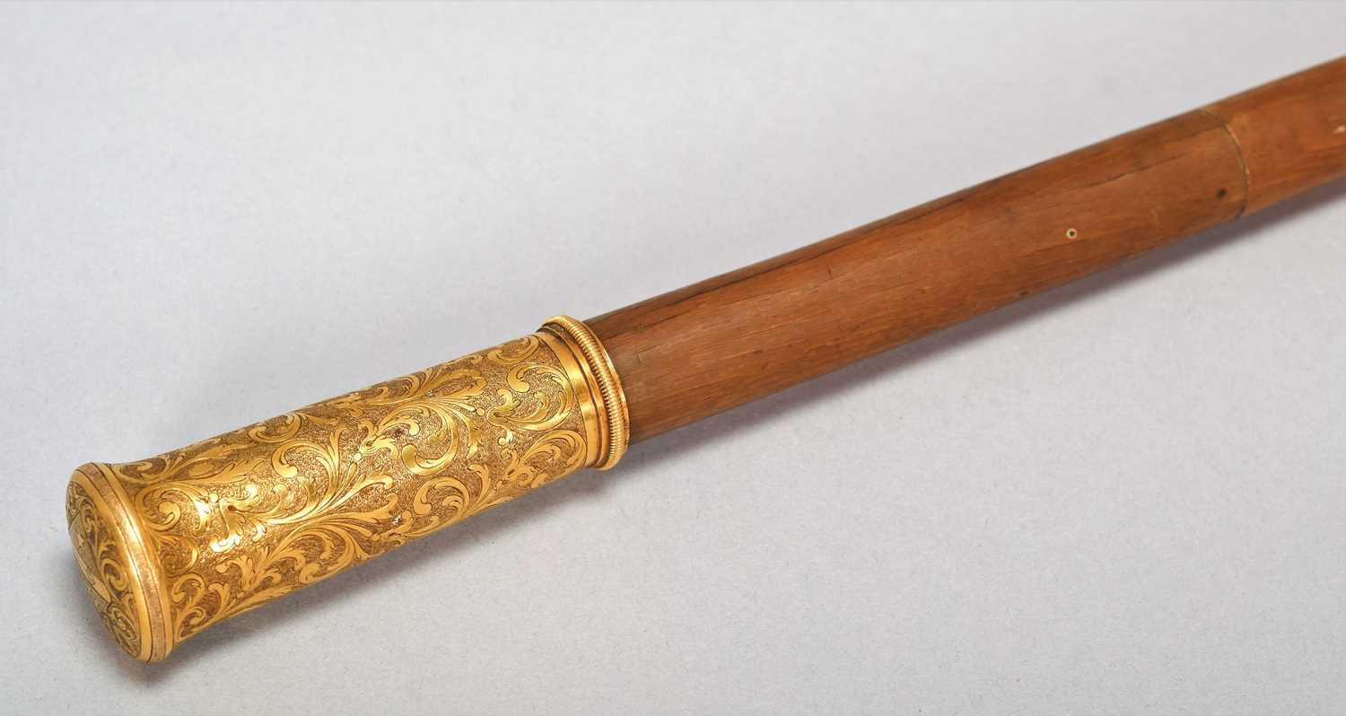 Natural History: A Late Victorian Rhinoceros Horn Walking Cane, circa 1870-1900, the gilt metal