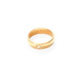 A 22 Carat Gold Diamond Solitaire Ring, the old cut diamond in a yellow star setting, to a plain