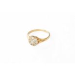 A Diamond Cluster Ring, the old cut diamonds in yellow claw settings, to a plain polished shank,