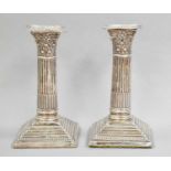 A Pair of Edward VII Silver Candlesticks, by W. G. Keight and Co., Birmingham, 1904, with stepped