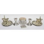 A Silver powder Compact, a glass powder bowl with silver cover, a pair of dwarf candlesticks, and