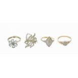 Four 9 Carat Gold Rings, including three diamond cluster examples and an aquamarine and diamond