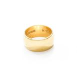 An 18 Carat Gold Band Ring, finger size L1/2Gross weight 8.5 grams.