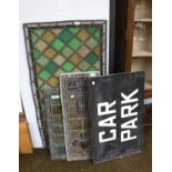 Five Stained and Leaded Glass Panels, largest 118cm by 62cm; together with a painted folding carpark