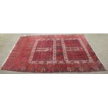 An Afghan Ersari Hatchli, claret quartered field of candela motifs enclosded by borders of geometric