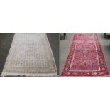 A Hussainabad Rug, the strawberry Herati field enclosed by borders of stylised plants, 282cm by