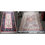 A Thrace Kilim, the ivory field with three large stylised flowering plants enclosed by indigo