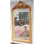 A Large Gilt Framed Mirror, in 18th century style, with foliate open work pediment and bevelled