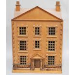 A 20th century three storey dolls house complete with furnitureRoof and facade hinges opening