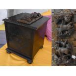 An Early 20th Century Oak Coal Box; together with a Black Forest carved oak book stand