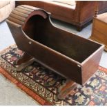 A Victorian Stained Pine Cradle on Stand, with fluted canopy, 93cm by 44cm by 69cm