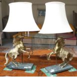 A Pair of Gilt Metal Marley Horse Table Lamps, on marble bases, height including shade 70cm