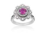 A Pink Sapphire and Diamond Cluster Ringthe round cut pink sapphire within a border of round