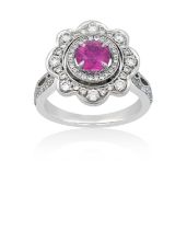 A Pink Sapphire and Diamond Cluster Ringthe round cut pink sapphire within a border of round