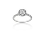 A Platinum Diamond Cluster Ringthe cushion shaped diamond within a border of round brilliant cut