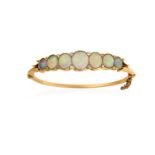An Opal and Diamond Banglethe seven graduated oval cabochon opals spaced by old cut diamond accents,