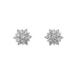 A Pair of Diamond Cluster Earringsthe central raised round brilliant cut diamond, within a border of