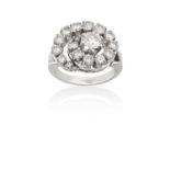 A Diamond Cluster Ring the central round brilliant cut diamond within a graduated round brilliant