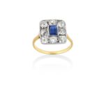 A Sapphire and Diamond Cluster Ring the rectangular step cut sapphire in a white millegrain setting,