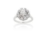 A Diamond Cluster Ringthe central raised old cut diamond within a border of smaller old cut