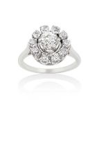 A Diamond Cluster Ringthe central raised old cut diamond within a border of smaller old cut