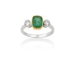 An Emerald and Diamond Three Stone Ringthe cushion shaped emerald in a yellow rubbed over setting,