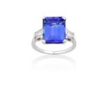 A Tanzanite and Diamond Ringthe emerald-cut tanzanite flanked by baguette cut diamonds, in white