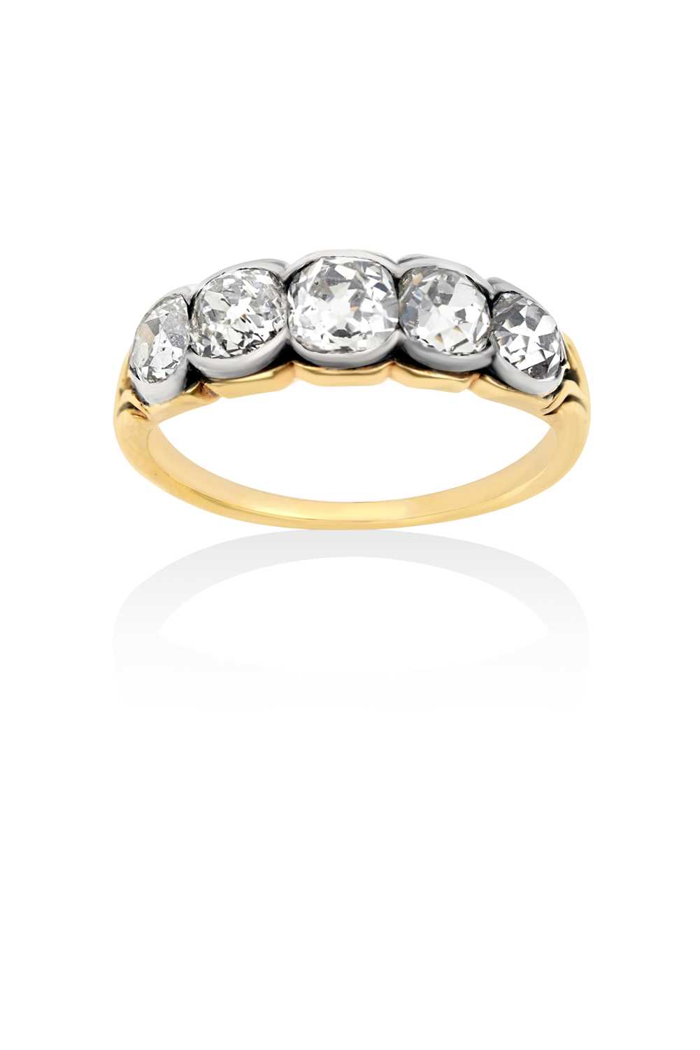 A Diamond Five Stone Ringthe graduated old cut diamonds in white rubbed over settings, to a yellow