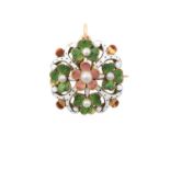 An Edwardian Enamel and Pearl Brooch the central pearl within a floral border enamelled in pink