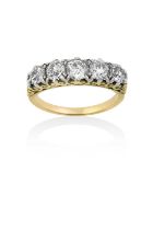 A Diamond Five Stone Ringthe graduated old cut diamonds in white claw settings, with a yellow scroll