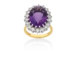 An 18 Carat Gold Amethyst and Diamond Cluster Ringthe oval cut amethyst within a border of round