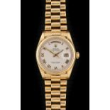 Rolex: An 18 Carat Gold Automatic Day/Date Centre Seconds Wristwatch with an Unusual Pyramid Pattern