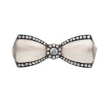 An Art Deco Diamond and Rock Crystal Broochrealistically modelled as a bow, the central old cut