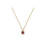 An 18 Carat Gold Ruby and Diamond Pendant on Chainthe oval cut ruby within a border of round