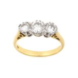 A Diamond Three Stone Ringthe graduated round brilliant cut diamonds, in white claw settings, to a