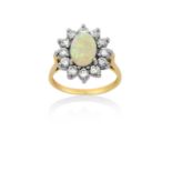 An 18 Carat Gold Opal and Diamond Cluster Ringthe oval cabochon opal within a border of round