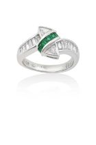 An Emerald and Diamond Ringa row of calibré cut emeralds flanked by trilliant cut diamonds, to