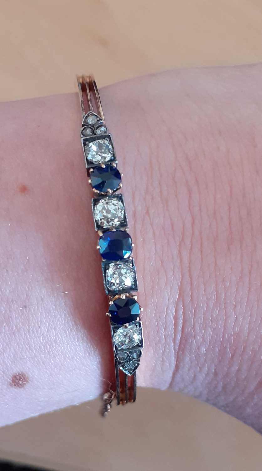 A Sapphire and Diamond Banglethree round cut sapphires in yellow claw settings alternate with old - Image 3 of 3