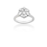 A Platinum Diamond Cluster Ring, by Rhapsody the central round brilliant cut diamond sat below a
