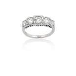 A Diamond Five Stone Ring the graduated old cut diamonds in white square settings, to a tapered