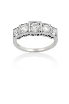 A Diamond Five Stone Ring the graduated old cut diamonds in white square settings, to a tapered