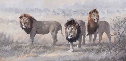Michael Ghaui (b.1950) TanzanianLions on the plain before herds of Wildebeest and Zebras Signed, and