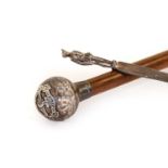 A Northern Rhodesia Police Malacca Swagger Stick, with globular silver pommel and ferrule, hallmarks